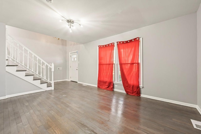 unfurnished living room featuring hardwood / wood-style floors