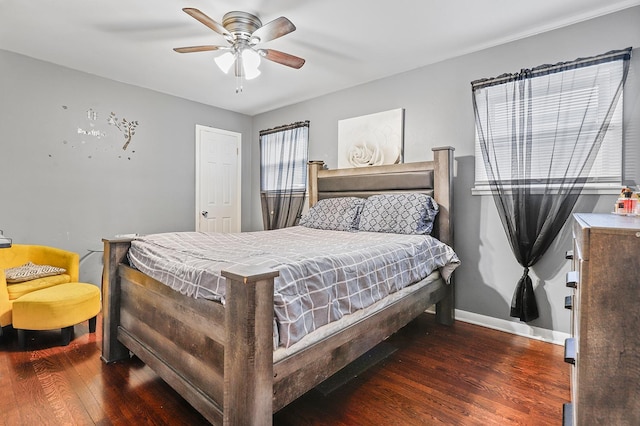 bedroom featuring dark hardwood / wood-style floors and ceiling fan