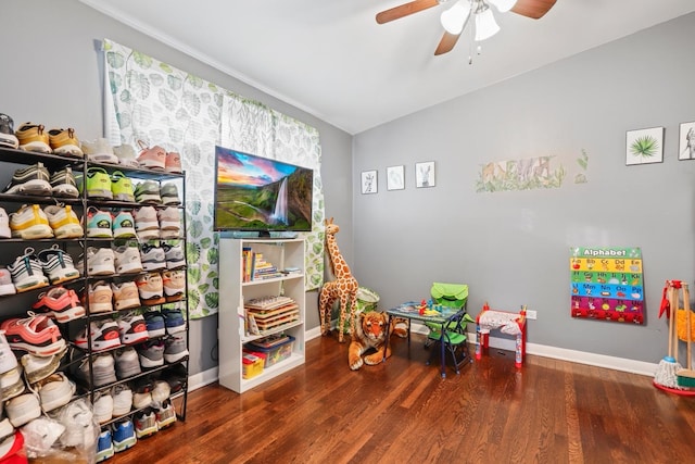 playroom with dark hardwood / wood-style floors and ceiling fan