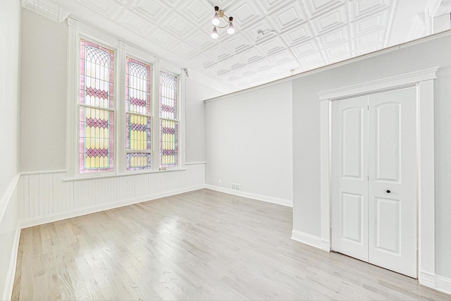 unfurnished room with light hardwood / wood-style flooring