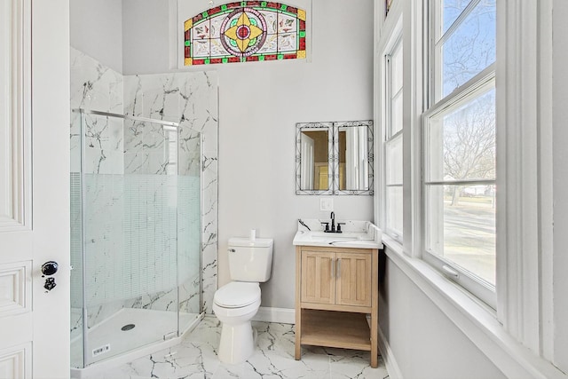 bathroom featuring a wealth of natural light, vanity, an enclosed shower, and toilet