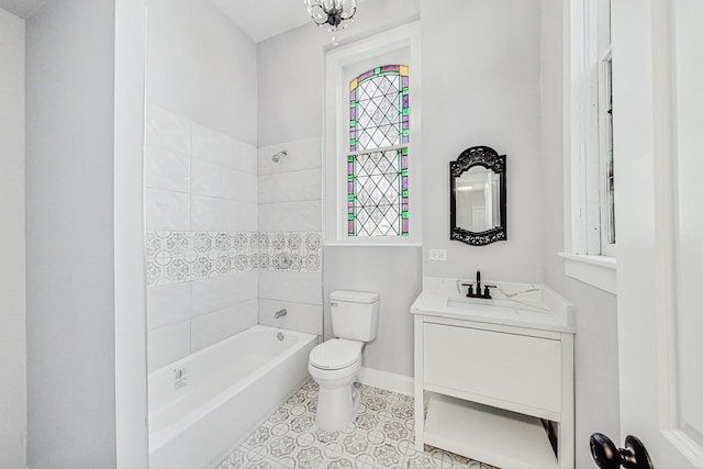 full bathroom with an inviting chandelier, vanity,  shower combination, and toilet