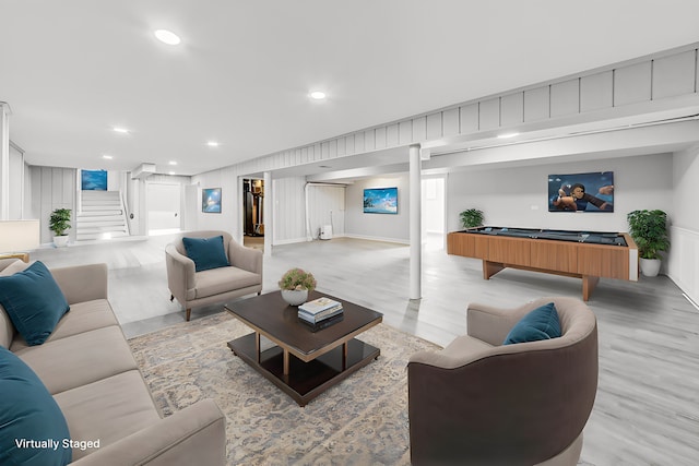 living room featuring billiards and light wood-type flooring