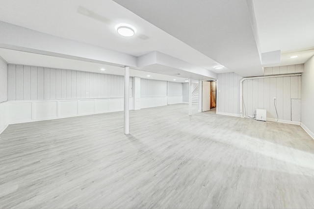 basement featuring light wood-type flooring