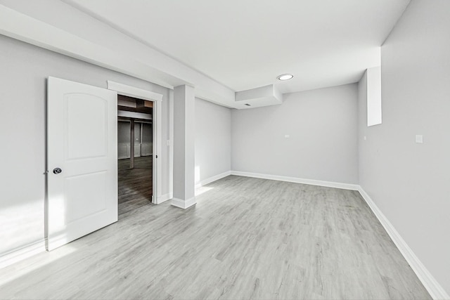 basement featuring light wood-type flooring