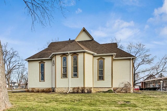 view of property exterior with a lawn