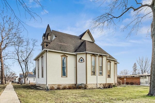 view of property exterior with a yard