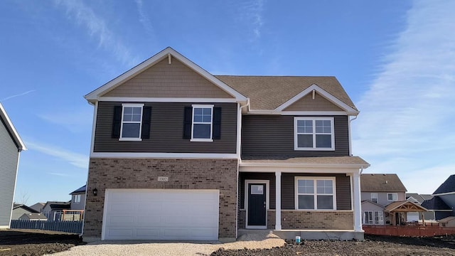 view of front of property featuring a garage and covered porch