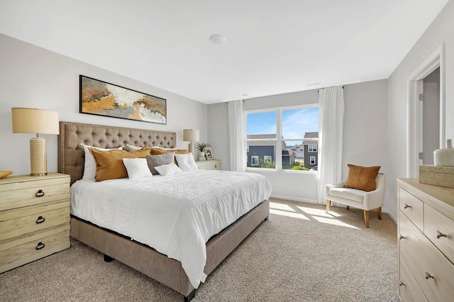 bedroom featuring light colored carpet