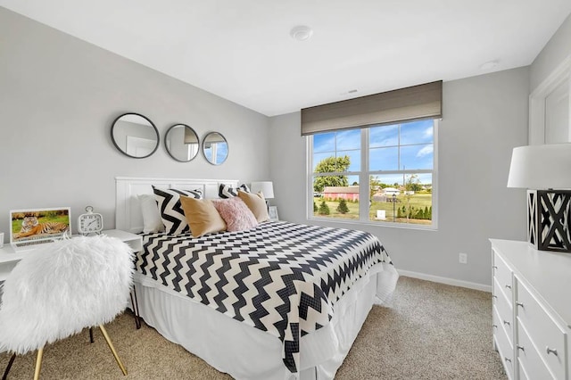 bedroom featuring light colored carpet