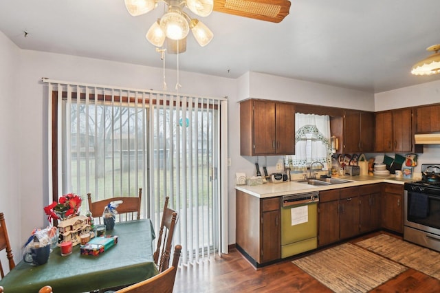 kitchen featuring sink, dark hardwood / wood-style floors, plenty of natural light, electric stove, and dishwashing machine