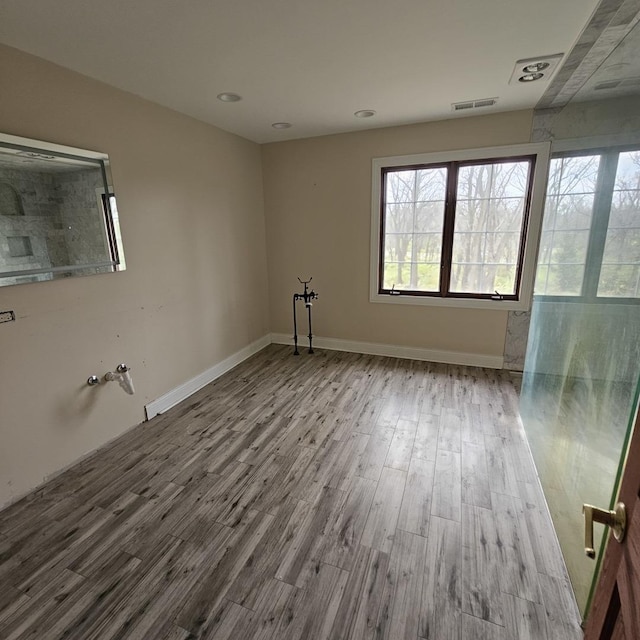 unfurnished room with light hardwood / wood-style floors