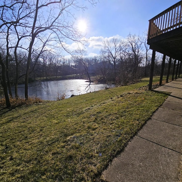 view of yard featuring a deck with water view