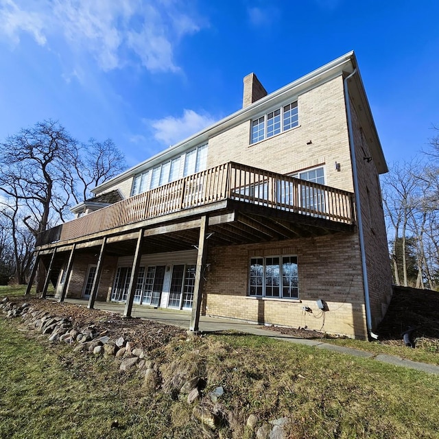 rear view of property with a deck