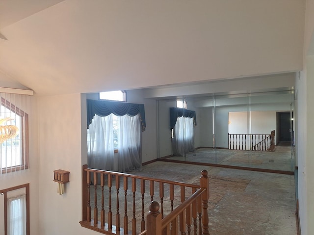 foyer entrance featuring high vaulted ceiling