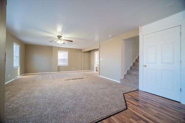 spare room featuring dark hardwood / wood-style flooring and ceiling fan