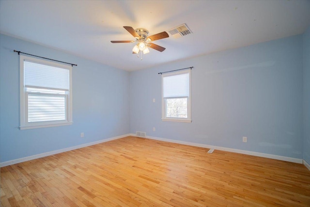 spare room featuring ceiling fan and light hardwood / wood-style floors