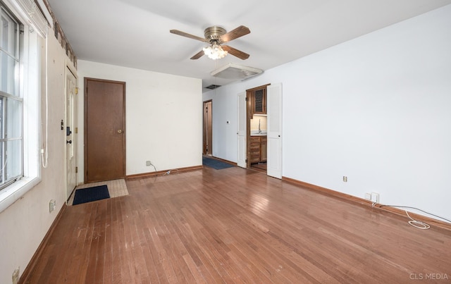 spare room featuring ceiling fan and hardwood / wood-style floors