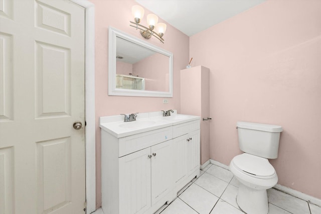 bathroom featuring walk in shower, a notable chandelier, tile patterned floors, toilet, and vanity