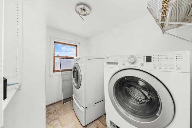 laundry area with independent washer and dryer