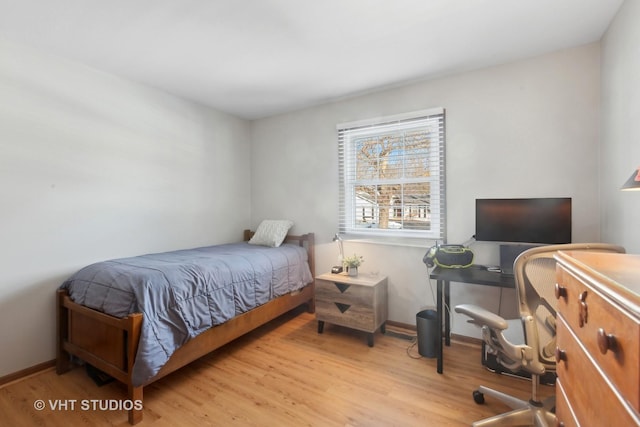 bedroom with light hardwood / wood-style floors