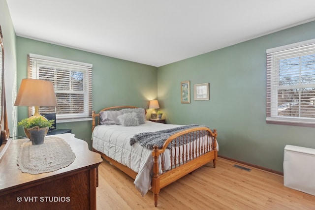 bedroom with light wood-type flooring