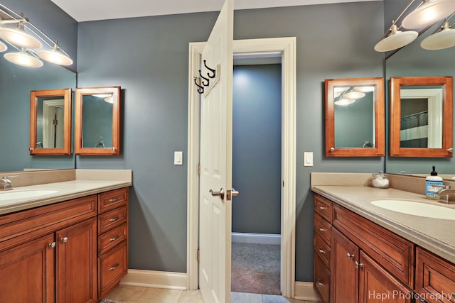 bathroom with tile patterned floors and vanity