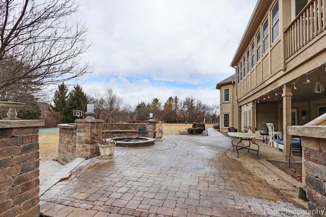 exterior space featuring an outdoor fire pit