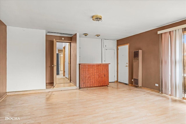 spare room featuring light hardwood / wood-style flooring