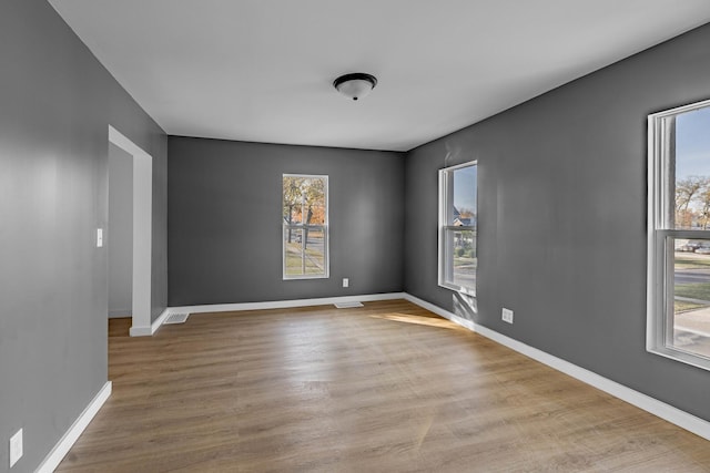 spare room featuring light hardwood / wood-style floors