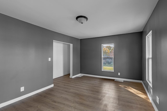 spare room featuring dark hardwood / wood-style floors