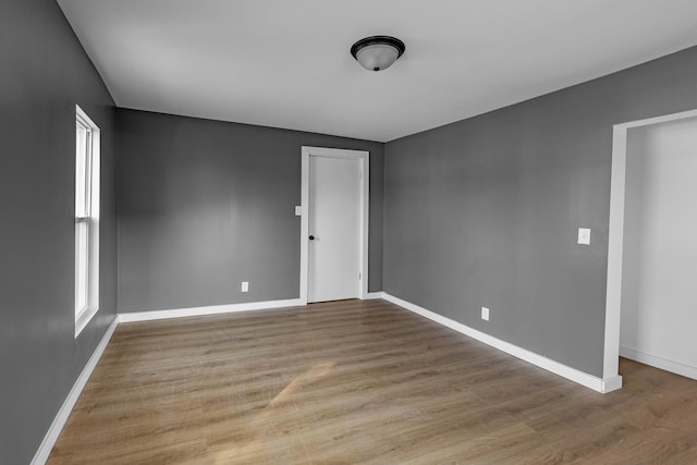 unfurnished room featuring light hardwood / wood-style floors