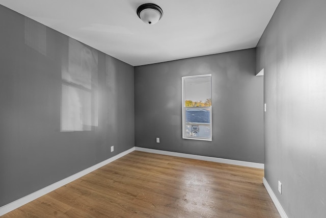 unfurnished room featuring wood-type flooring