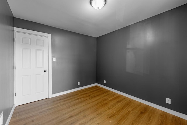 unfurnished room featuring light hardwood / wood-style floors