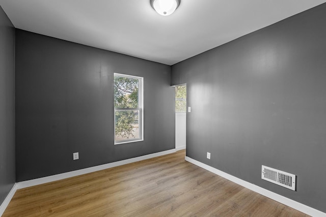 spare room featuring light hardwood / wood-style flooring