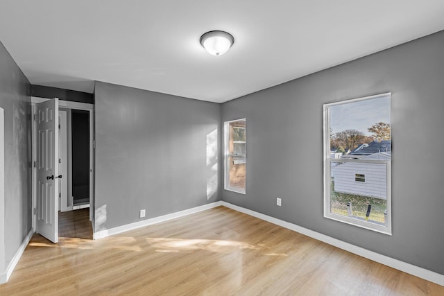 unfurnished room featuring light wood-type flooring