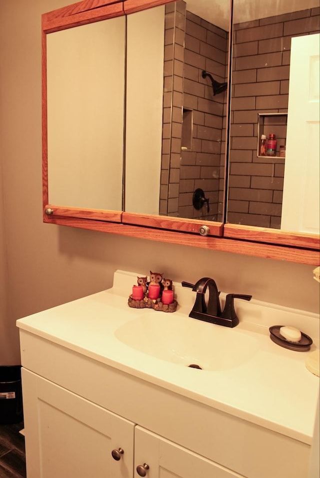 bathroom featuring wood-type flooring and vanity