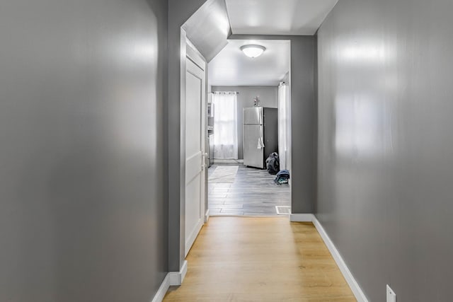 hallway featuring light hardwood / wood-style flooring