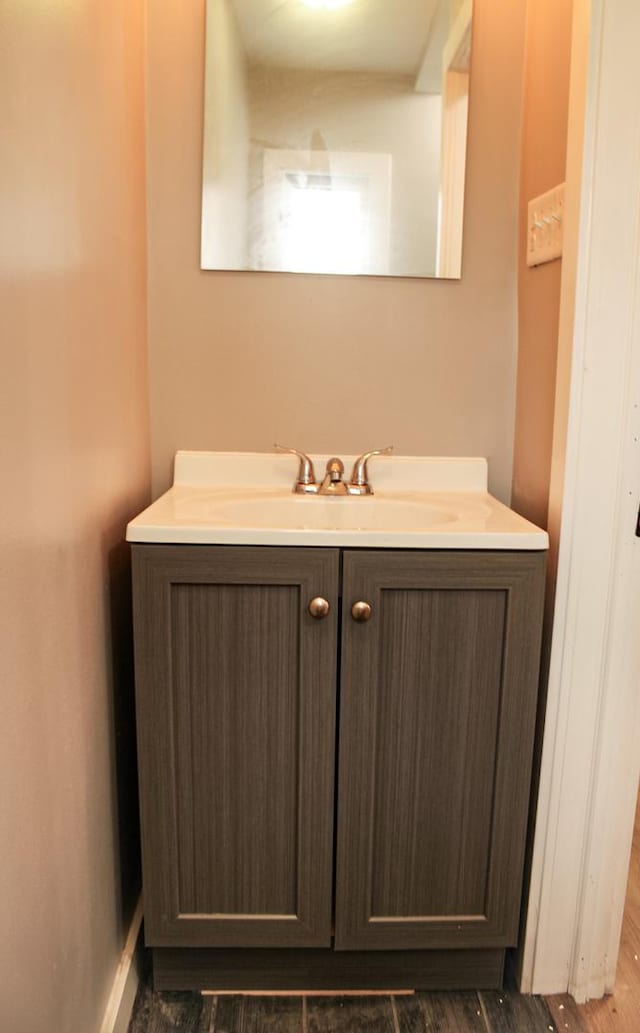 bathroom featuring vanity and hardwood / wood-style floors