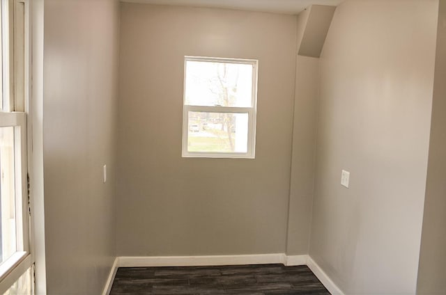 unfurnished room with dark hardwood / wood-style floors