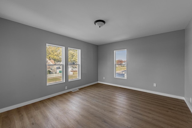 empty room featuring dark hardwood / wood-style floors