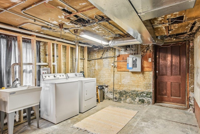 basement with washer and dryer and electric panel