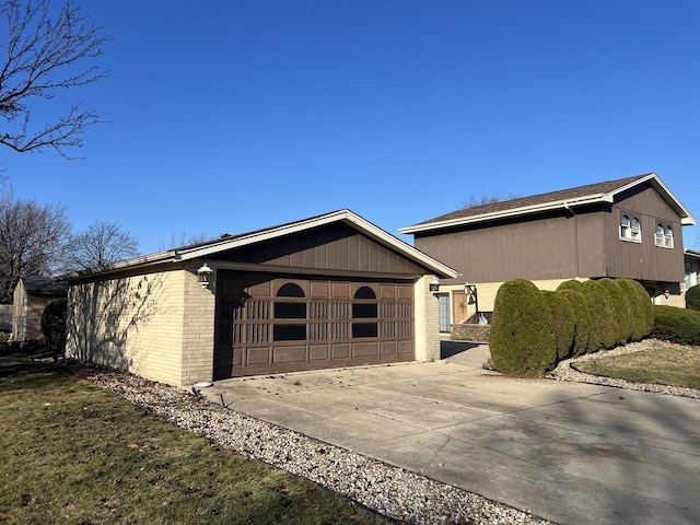 view of side of home featuring a garage