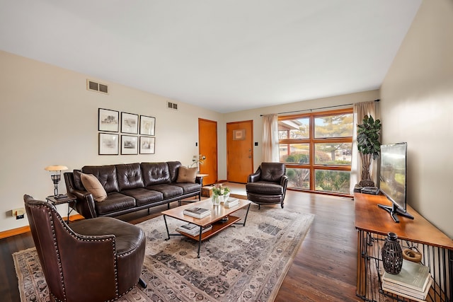 living room with dark hardwood / wood-style flooring