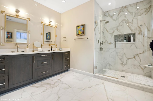 bathroom featuring vanity and an enclosed shower