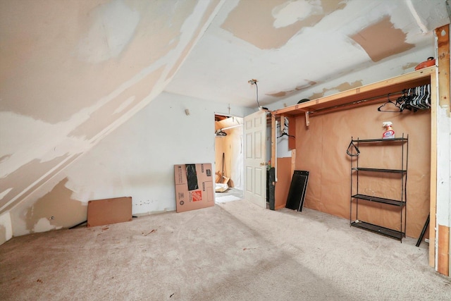 bonus room featuring carpet flooring and vaulted ceiling