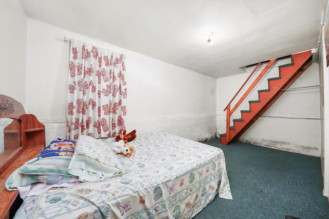 carpeted bedroom with crown molding