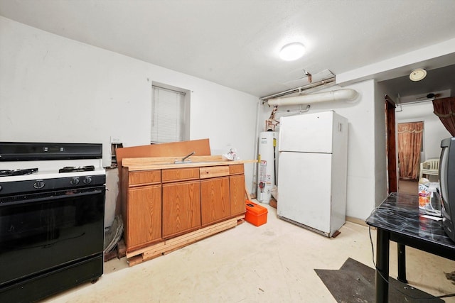 kitchen with white fridge, gas water heater, and black range with gas cooktop