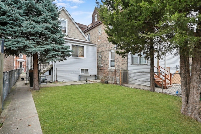 back of house featuring a yard