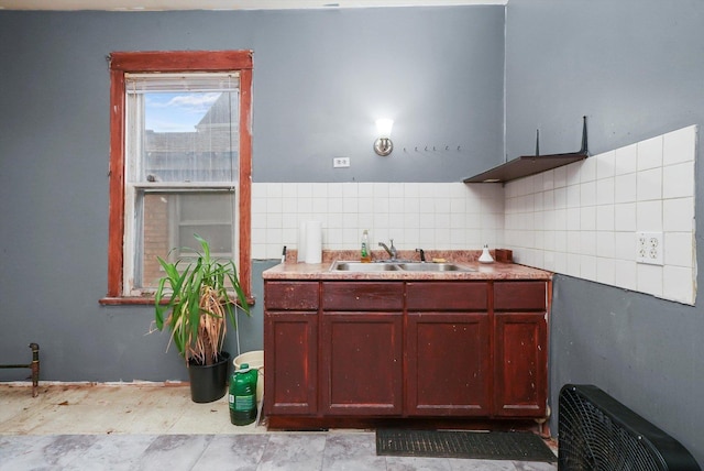 bathroom with backsplash and sink